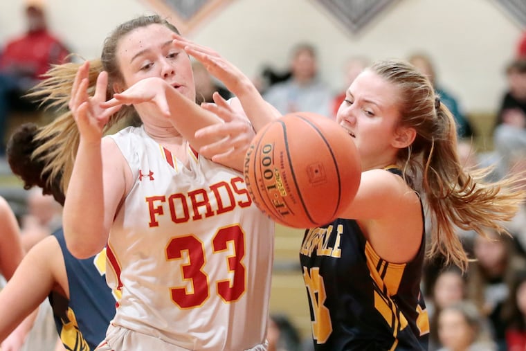 Haverford’s Mollie Carpenter (33) and Unionville’s Emma Dempsey fight for a rebound in the second half.