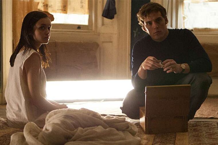 Olivia Cooke as Jane Harper and Sam Claflin as Brian McNeil in "The Quiet Ones." (Lionsgate)