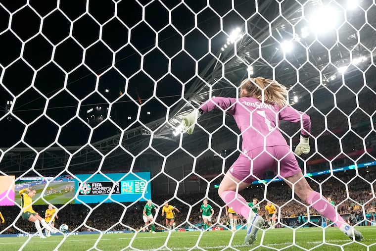 Australia's Steph Catley (left) kicks from the penalty spot to score against Ireland goalkeeper Courtney Brosnan during the Women's World Cup opener in Sydney, Australia, on Thursday.