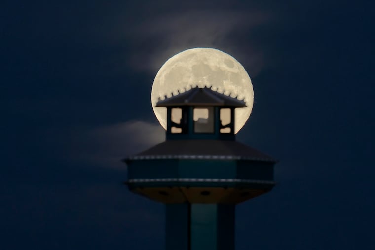 October’s supermoon, known as the Hunter’s moon, rises over Wildwood amusements last October. It remains the one and only moon.