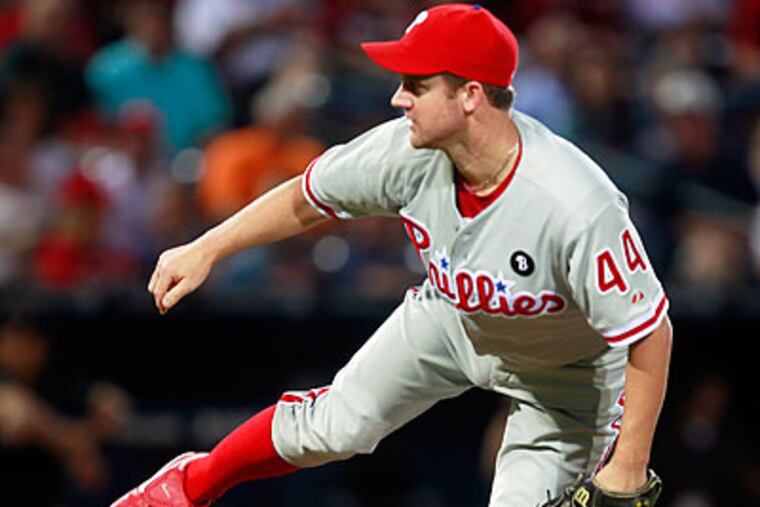 Roy Oswalt pitched six shutout innings in the Phillies' win over the Braves. (John Bazemore/AP)