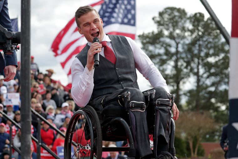 Rep. Madison Cawthorn, R-N.C., speaks before former President Donald Trump takes the stage at a rally on April 9, 2022, in Selma, N.C. A series of unforced political and personal errors by Cawthorn has brought the forces of big-name Republicans and traditional enemies to bear on his reelection bid in North Carolina.