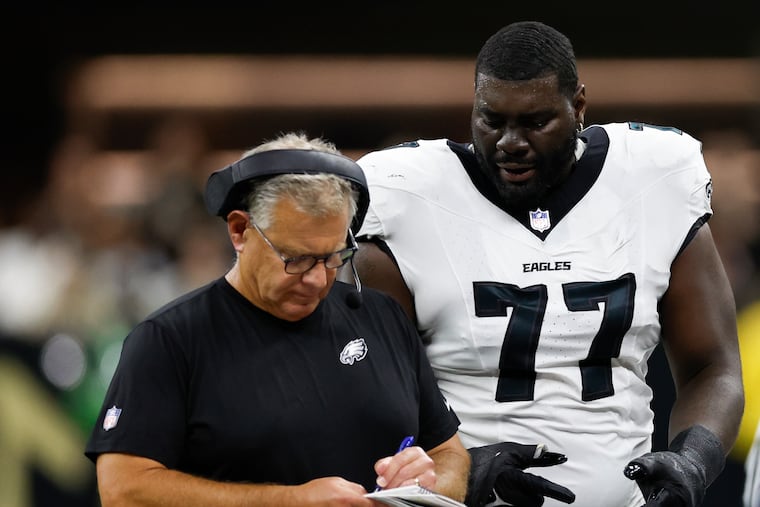 Eagles offensive tackle Mekhi Becton talks to offensive line coach Jeff Stoutland, who had two backup offensive linemen playing well in Sunday's win in New Orleans.