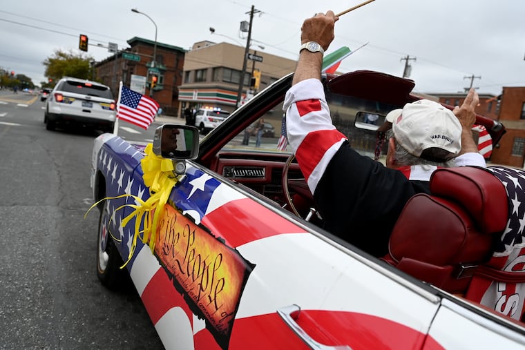 Fran DiBacco drives his 1976 Cadillac Eldoradol Convertible on South Broad Street in the annual Columbus Day Parade on Sunday.