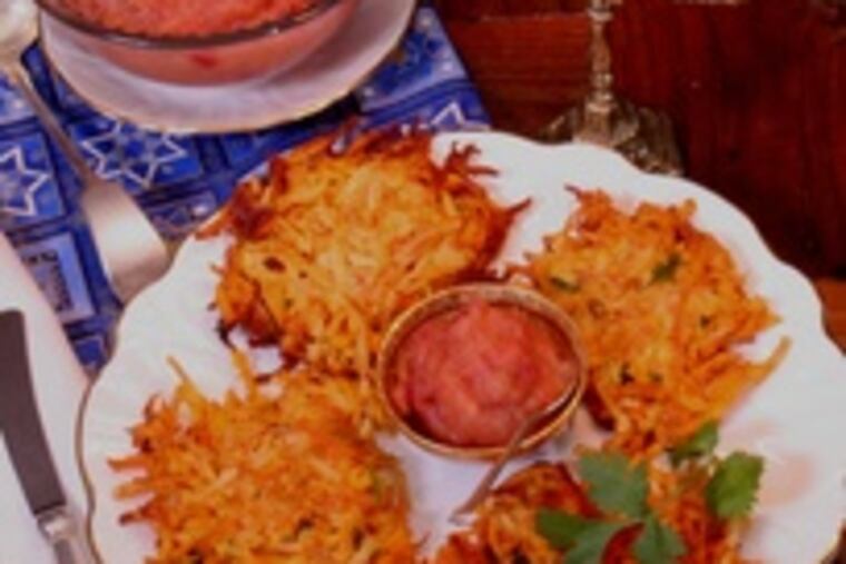 Carrot-yam latkes with spiced apple and gin puree are a creation of Matthew Levin, executive chef of Lacroix at the Rittenhouse. He loves his latkes rich.