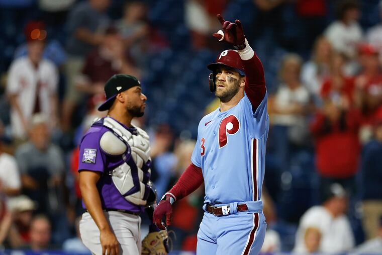 Bryce Harper crosses the plate after hitting a solo home run in the first inning against the Colorado Rockies.