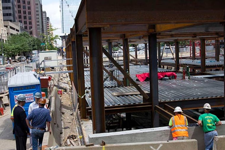Philadelphia police and fire departments report to 19th and Arch streets for a construction accident that sent one worker to the hospital. A firefighter on scene suffered a seizure and collapsed. (Alejandro A. Alvarez/Staff)