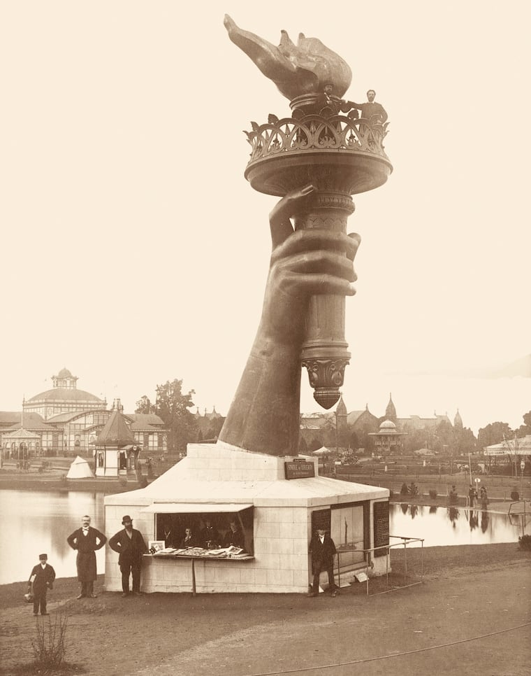 The Statue of Liberty's torch at the Centennial Exhibition of 1876 in Philadelphia. As a way to raise funds to build a pedestal for Lady Liberty, visitors could, with a small donation, climb a staircase inside the statue and get a bird's-eye view of the festivities.