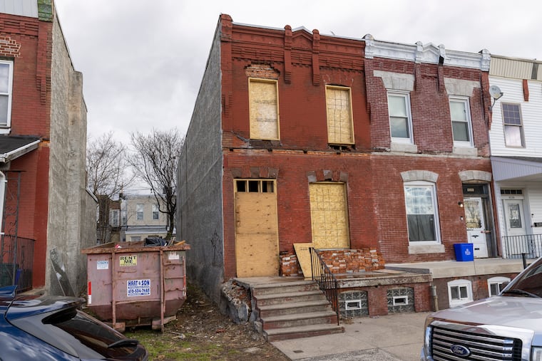 Some of the rents that RAD Diversified REIT says in SEC filings that it's expecting appear to be overstated, in light of the buildings’ conditions. This boarded-up rowhouse at 4243 Leidy Ave., for example, is said to be earning the company $14,400 a year in rent — even though it has no rental license and its most recent license was as a vacant property.