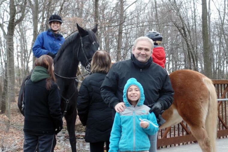 Jack McCarthy (center) and his granddaughter Gia McCusker, 8, hiking the new 1.5-mile Poquessing Creek Trail.