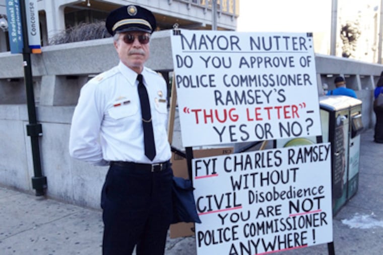Ray Lewis, a retired Philadelphia police captain, was across the street from City Hall Monday protesting threats made against him for wearing his old uniform at Occupy Wall Street demonstrations. (Robert Moran / Staff)