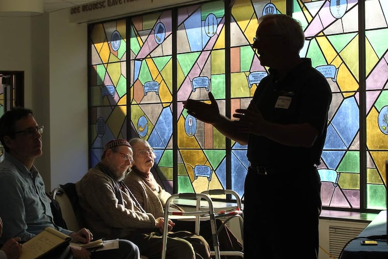 Retired Rear Admiral David W. Titley speaks about global warming at Temple Adath Israel. He told about 40 people in attendance Sunday that there is “overwhelming evidence that our climate is changing.”