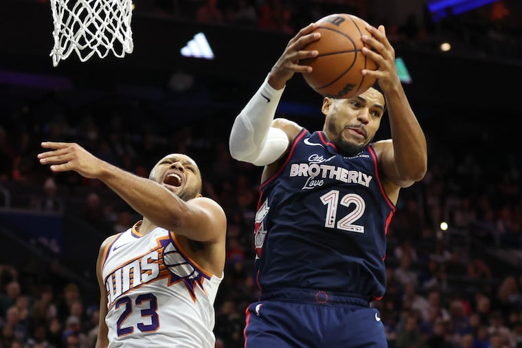 Phoenix Suns guard Eric Gordon fighting for a rebound against the Sixers' Tobias Harris on Nov. 4, 2023.