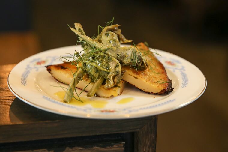 Wood-grilled chunks of baby artichokes came mounded atop a warm chickpea pancake called “farinata” (an Italian riff on the suddenly popular socca) at Fiore.