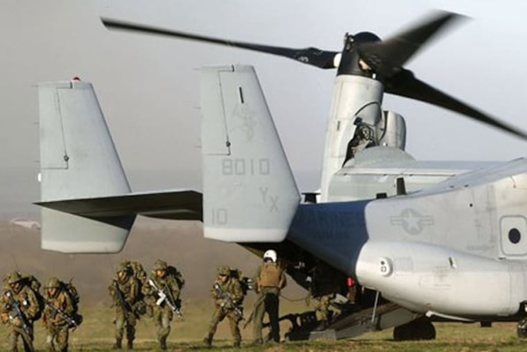 In this Feb. 13, 2013 photo, Japanese Ground Self-Defense Force soldiers deplane U.S. Marine MV-22 Osprey during U.S.-Japan joint military drill at the Camp Pendleton Marine Corps base, Calif. Japanese troops will converge on California's southern coast in the next two weeks, the middle of June 2013, as part of a military exercise with U.S. troops aimed at improving that country's amphibious attack abilities. (AP Photo/Kyodo News)
