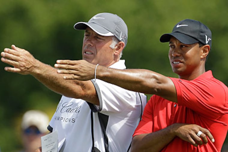 Steve Williams (left) worked as Tiger Woods' caddie for 12 years. (Lynne Sladky/AP file photo)