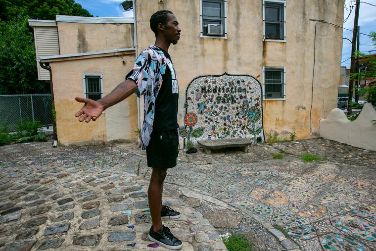 Terrell Green with outstretched arms to symbolize inclusion for all at Meditation Park on 2500 block of N Warnock St. on Monday, July 20, 2020. Photograph for story about "PlayPenn, the new play development org, has been besieged by charges of racism and sex harassment over the past two weeks."