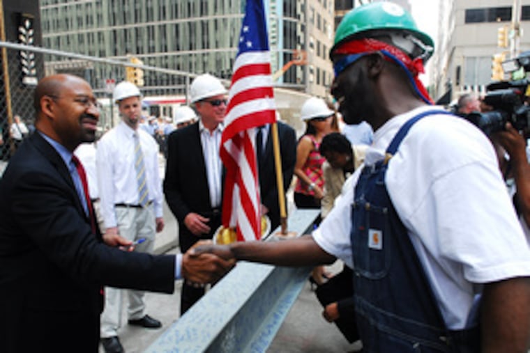 Mayoral candidate Michael Nutter shakes hands with Marvin Sabir at the Comcast building's topping-off.