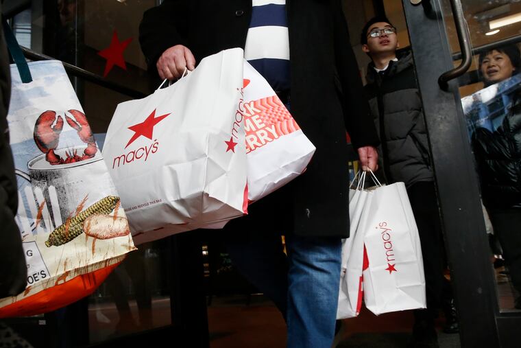 Shoppers leave a Macy's in Boston in 2019.