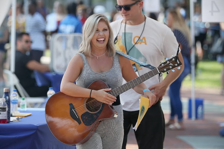 Sarah Diamond of Downingtown, Pa., reacts after passing on to the second round of auditions for American Idol at Franklin Square in Center City Philadelphia on Thursday, Sept. 6, 2018. Hundreds of people lined up early in the morning for a chance to appear on the long-running television singing competition.