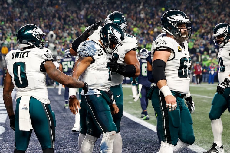 Eagles quarterback Jalen Hurts celebrates with teammates after scoring a touchdown during the first quarter against the Seattle Seahawks.
