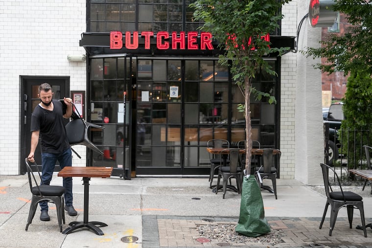 Outdoor seating is set up at the Butcher Bar in Rittenhouse on Thursday. Health Commissioner Thomas Farley said on Thursday that Philadelphia is unlikely to allow indoor dining to begin Aug. 1 as new cases of the coronavirus rise in the city.