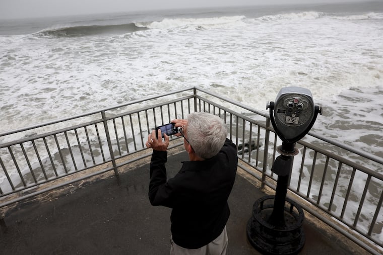 Geoff Ziegler, of Philadelphia, who owns a bungalow on the back bay in Ocean City, captures the rough surf stirred by Hurricane Erin last August. El Niño may mean a quieter hurricane season this year, and a strange winter.
