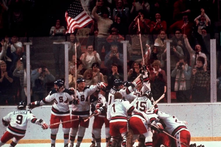 The U.S. men's hockey team pounces on goaltender Jim Craig after a 4-3 victory against the Soviet Union on Feb. 22, 1980 in Lake Placid, N.Y.