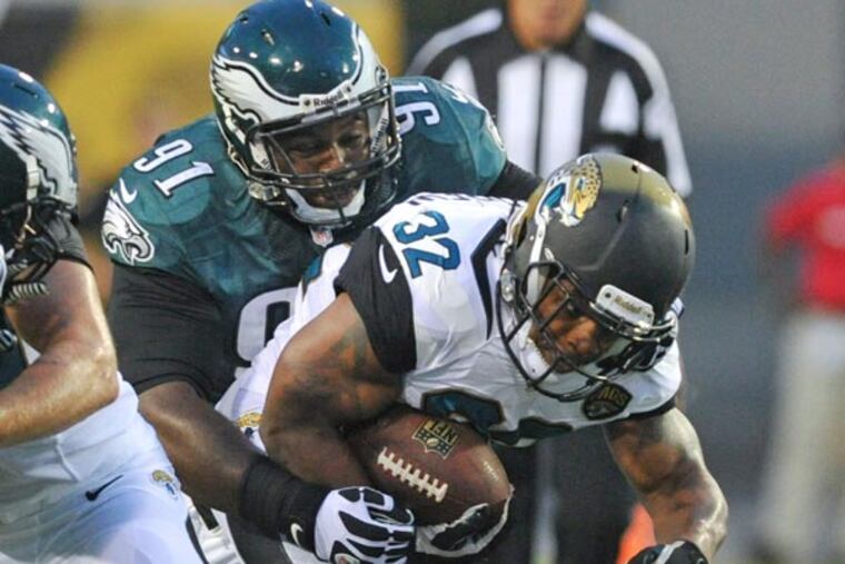 Jaguars running back Maurice Jones-Drew (32) is tackled by Philadelphia Eagles defensive tackle Fletcher Cox (91) during the first half of an NFL preseason football game, Saturday, Aug. 24, 2013, in Jacksonville, Fla. (Stephen Morton/AP)