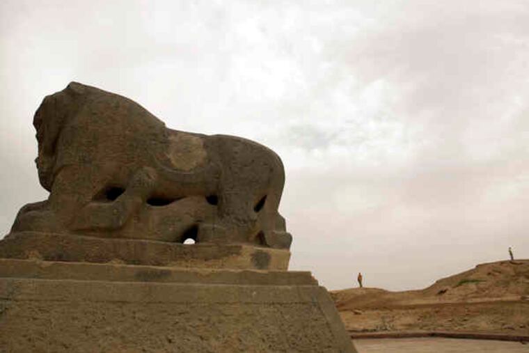 The Lion of Babylon, believed to be an ancient war treasure, stands in the ruins of Babylon in southern Iraq. A U.S.-funded restoration program is threatened by disputes.