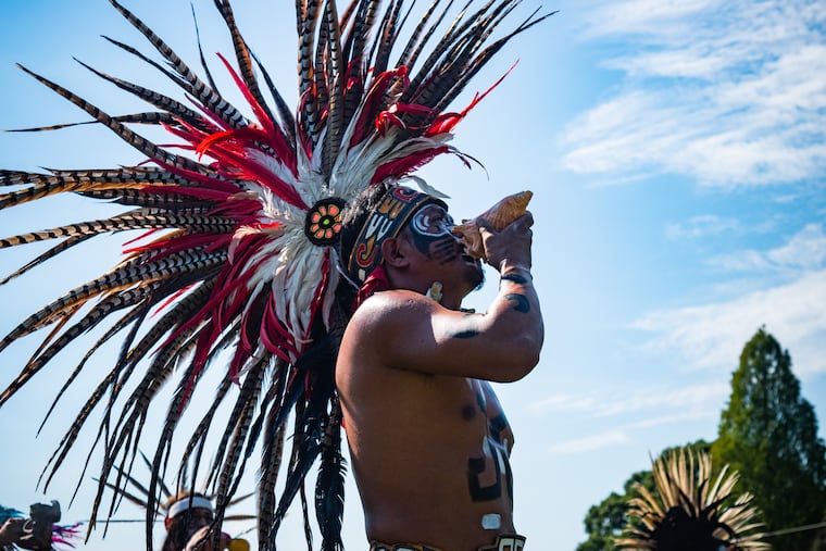 Ramiro Cantero Galicia performs in a Copili, a traditional Aztec crown at the Methacton Mennonite Church with La Danza Azteca.