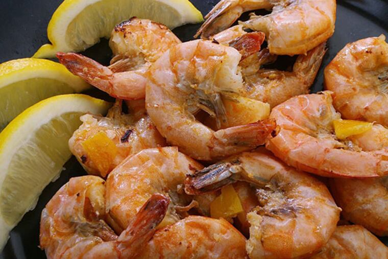 Cooked shrimp is sprinkled with preserved lemon. (J.B. Forbes/St. Louis Post-Dispatch/MCT)
