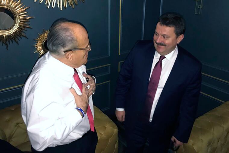 In this handout photo provided by Adriii Derkach's press office, Rudy Giuliani, an attorney for U.S President Donald Trump, left, meets with Ukrainian lawmaker Adriii Derkach in Kyiv, Ukraine, Thursday, Dec. 5, 2019. A Ukrainian lawmaker says he has met up with Rudy Giuliani, President Donald Trump’s personal attorney, in Kyiv to discuss an anti-corruption project. Derkach, who has previously accused the son of former Vice President Joe Biden of embezzling money from a gas company in Ukraine, posted photos of Thursday’s meeting on his Facebook page.