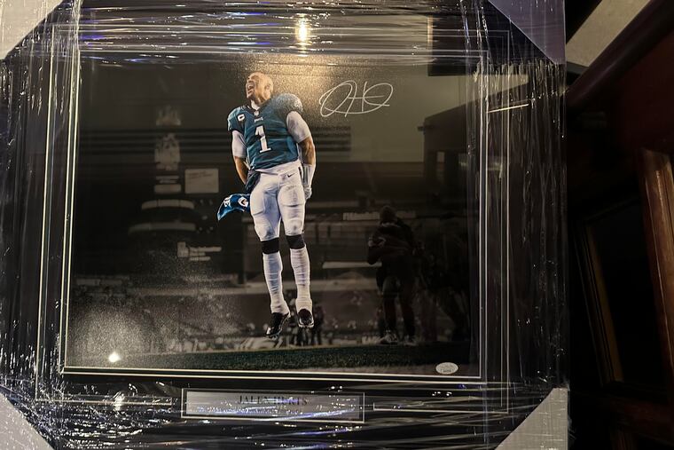 This signed, framed photo of Eagles quarterback Jalen Hurts was stolen from an ALS charity event in South Philly on Saturday.