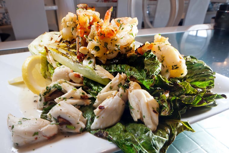 The OMG grilled romaine salad, with lettuce grilled topped with sauteed jumbo shrimp, colossal crabmeat over house-made Caesar dressing, as served at Catch 2401 Restaurant and Bar, Longport. ( DAVID M WARREN / Staff Photographer )