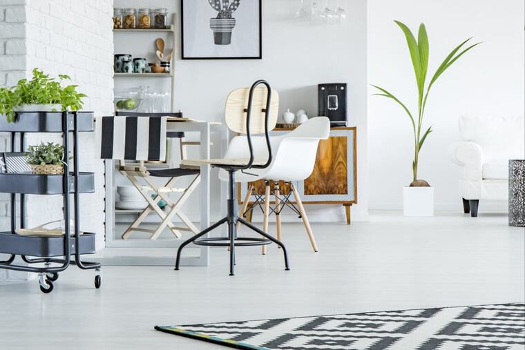 You can warm up concrete floors with rugs and soft furnishings.