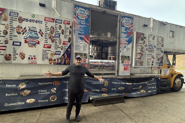 Jose Lora, the owner of the truck Delicias Dominicanas, pictured in front of his truck at the corner of West Hunting Park and North Front Street.