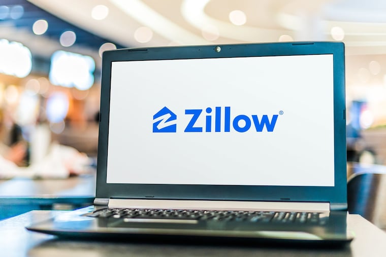 Seattle-based Zillow announced the cooling housing market and other factors led to financial losses, forcing the company to shut down its home-flipping division and lay off staff. (Dreamstime/TNS)