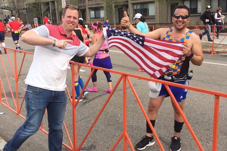 Former U.S. Army Sgt. Peter Farley congratulates his Iraqi interpreter Wisam Al-Baidhani, now a U.S. citizen, who ran the Boston Marathon for charity.