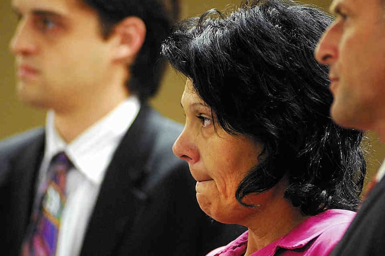 Elisa Baker in court in October on obstruction-of-justice charges. Yesterday she was charged with murdering her stepdaughter, Zahra Clare Baker (below).