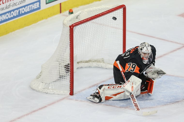 Carter Hart makes one of his 26 saves in Friday night's decisive won over the Rangers.