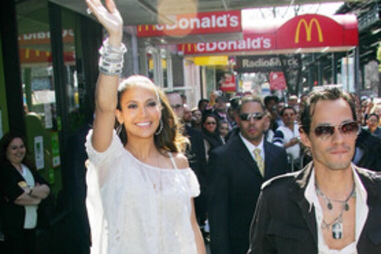 Jennifer Lopez and husband Marc Anthony arrive for a CD signing of her new Spanish-language album "Como Ama una Mujer." (See "Just a girl from the Bronx.")