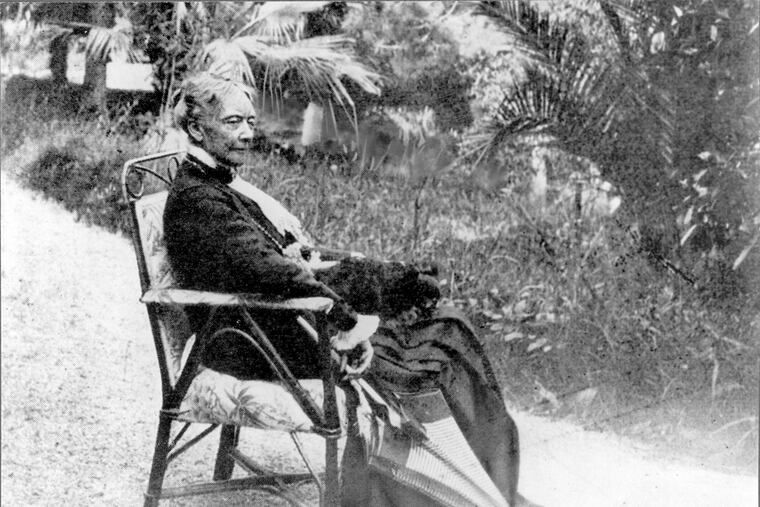 Mary Cassatt, 1844-1926. Cassatt seated in a chair with an umbrella. Verso reads "The only photograph for which she ever posed. Courtesy of Durand-Ruel.”