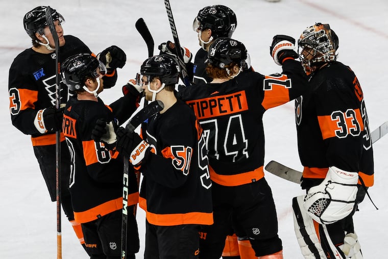 Goalie Samuel Ersson is congratulated by his teammates after backstopping the Flyers to a massive 4-3 win.