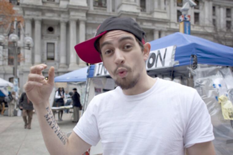 Michael Blas, 27, a member of Occupy Philly, said, "Undoing the wrongs of our ancestors" could take seven or eight years. (Ed Hille / Staff Photographer)