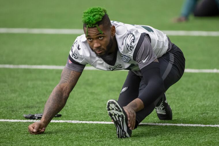 Eagles safety Jalen Mills, shown stretching before a practice last December, said he feels COVID safe at the NovaCare Complex.