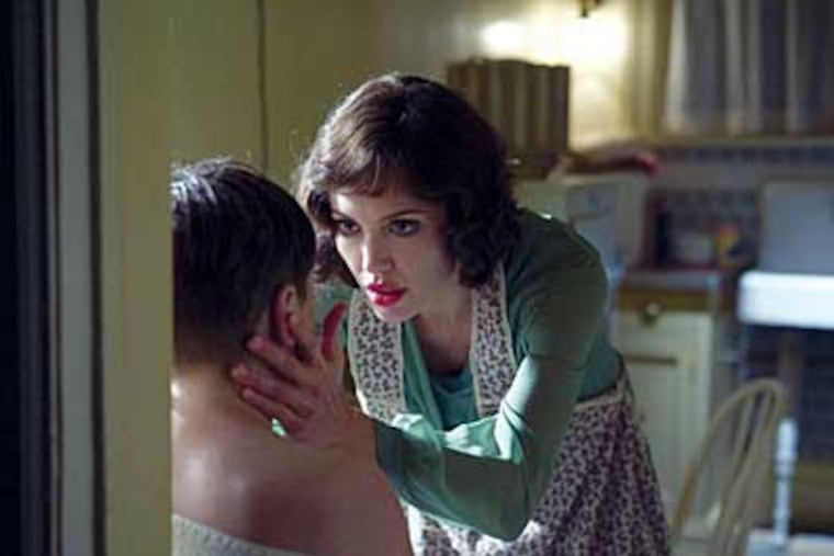 Angelina Jolie tries to prove that the boy in front of her is not her son in "Changeling."