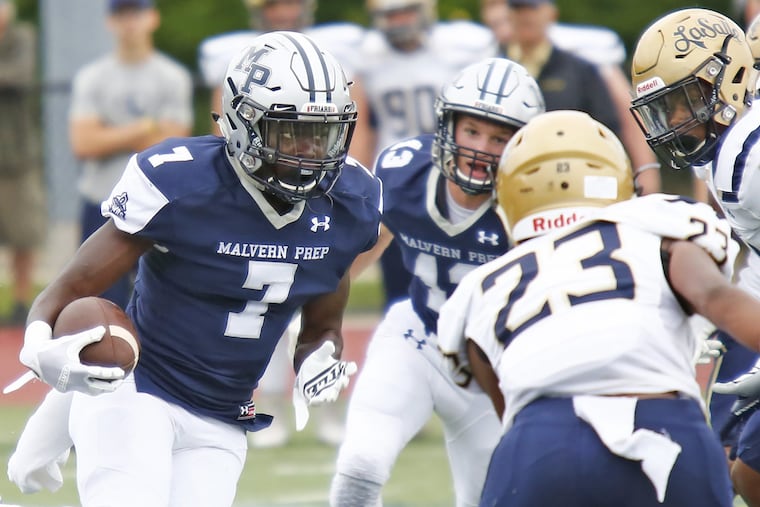 Malvern Prep's TyGee Leach (7) looks downfield en route to his 56-yard, first-quarter touchdown catch against La Salle.