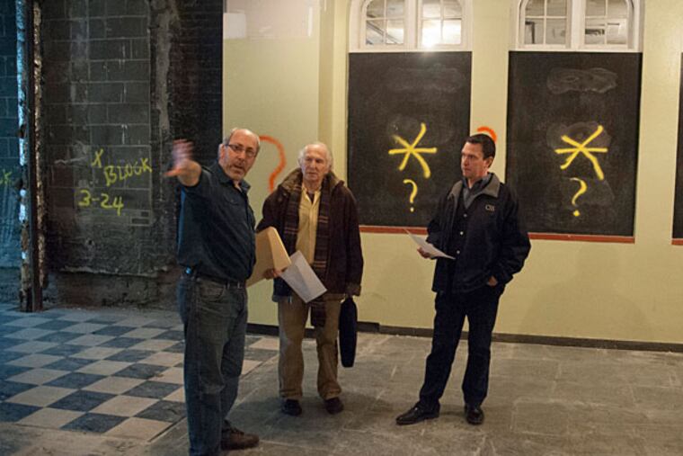 Seth Rozin (left), the producing artistic director of InterAct Theater Company, gives a tour in March of the old Drake Theater, which is undergoing extensive renovations to create two stages which will accommodate several resident theater companies. ( Photo: CLEM MURRAY / Staff Photographer )