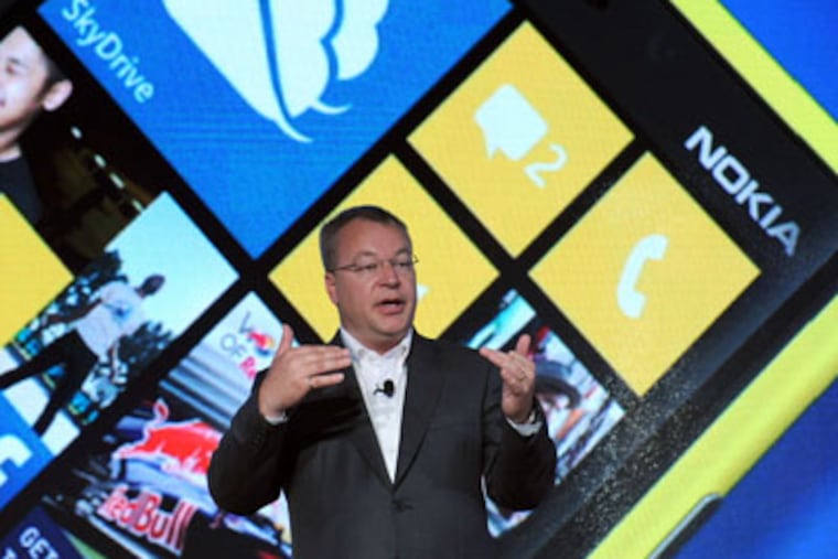 IMAGE DISTRIBUTED FOR NOKIA - Nokia President and CEO Stephen Elop debuts the Nokia Lumia 920, Nokia's flagship Windows Phone 8 smartphone, at a press event in New York, Wednesday, Sept. 5, 2012. The Lumia 920 features a camera able to take in five times more light than competing smartphones for sharp pictures in low light without flash, and the phone comes with integrated wireless charging and a suite of location-based apps for personalized mapping and navigation. (Photo by Diane Bondareff/Invision for Nokia/AP Images)